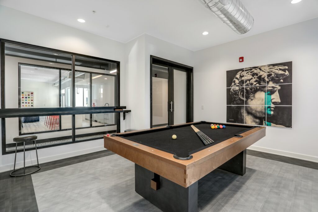 Billards room in clubhouse at The Roy Apartments